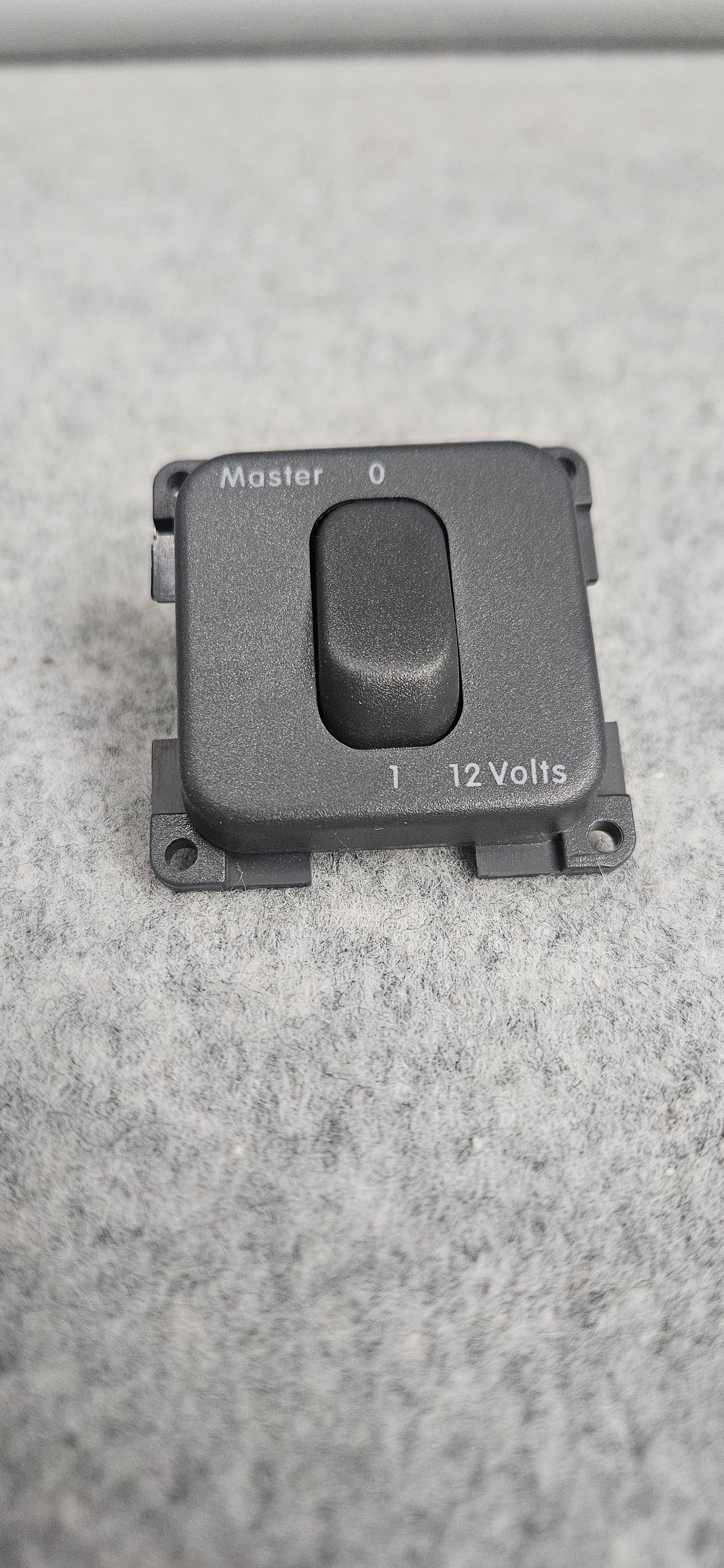 CBE dark grey single toggle switch, printed Master switch