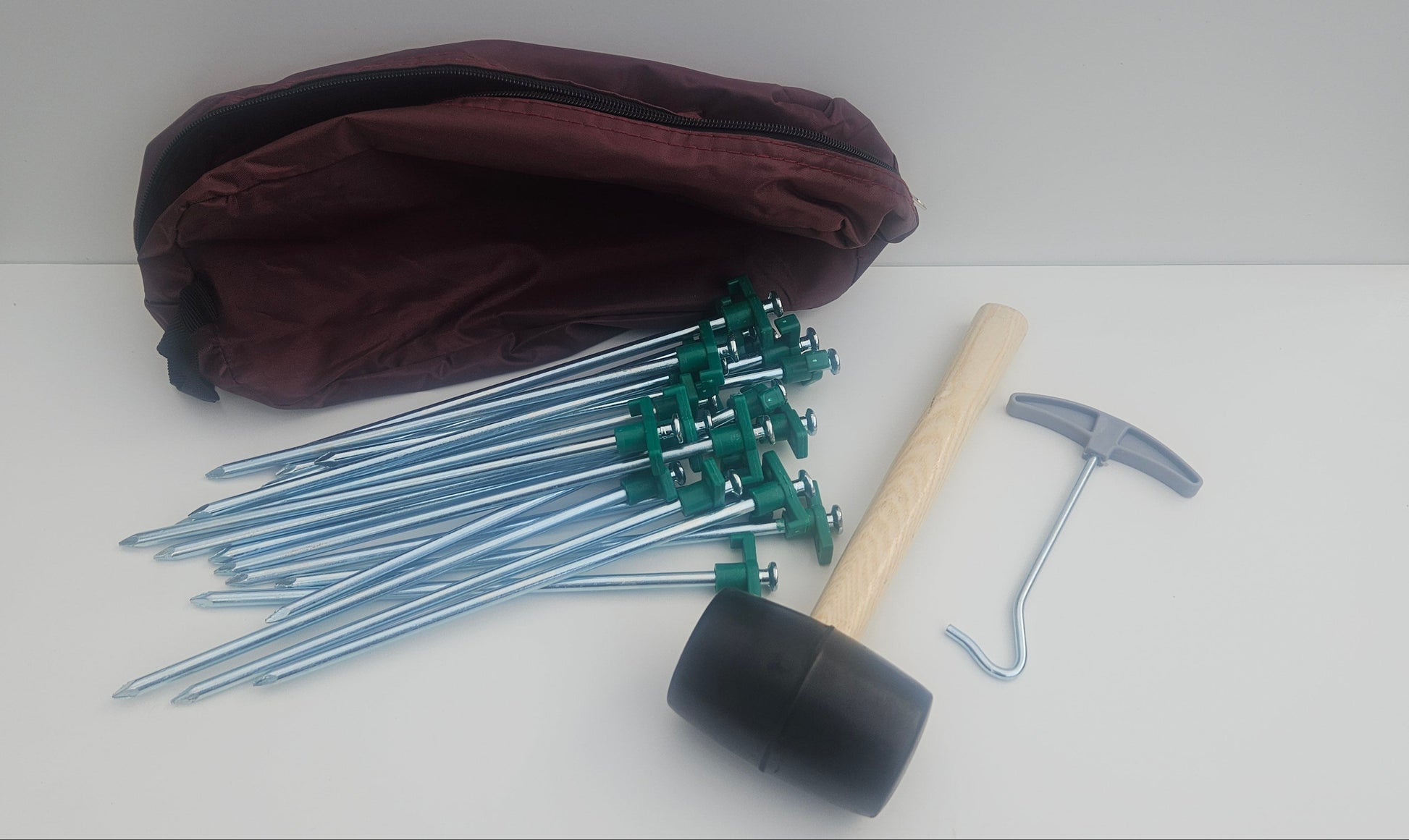 Tent peg, mallet, peg puller and bag camping kit