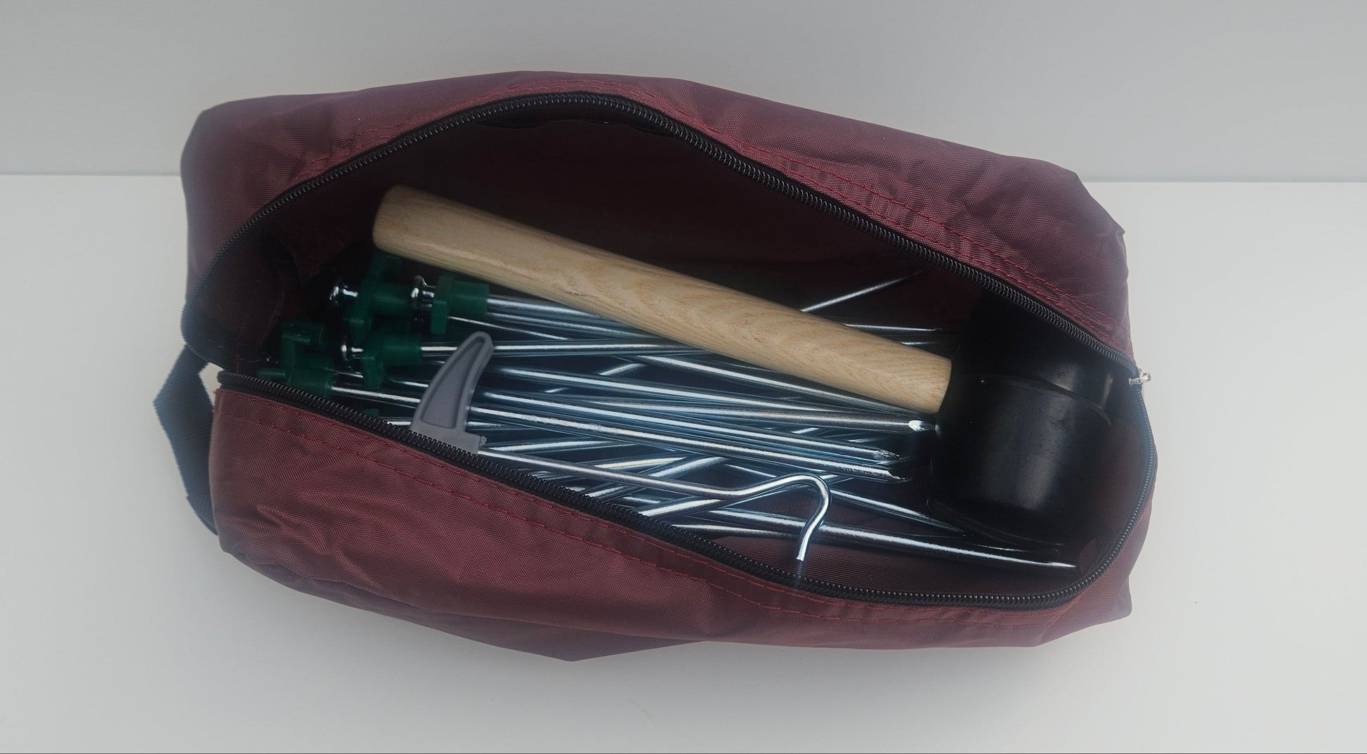 Tent peg, mallet, peg puller and bag camping kit